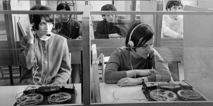 Kato Lomb Kató Lomb sits in an interpreting booth beside one other interpreter on the job.