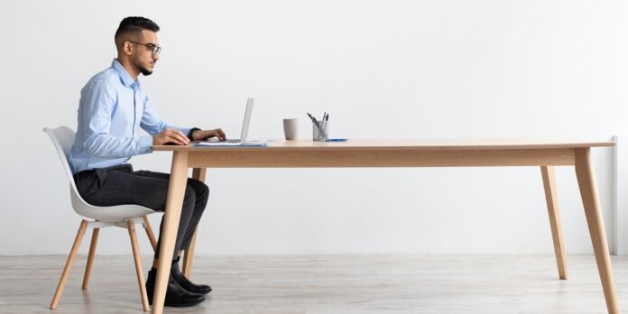 Middle Eastern man at computer