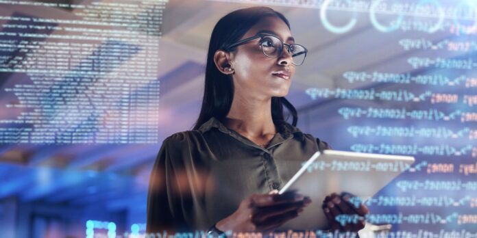 Woman looking at software code Woman looking at software code