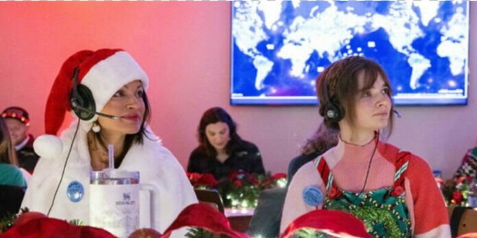 nterpreters Unlimited Help Track Santa for NORAD Two interpreters sit at the NORAD tracking table interpreting Santa's moves.