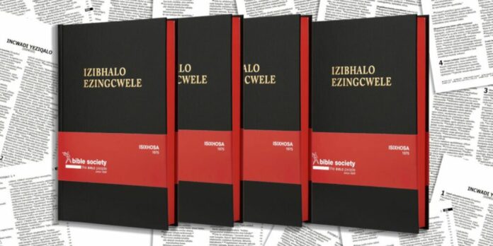 Multiple IsiXhosa Bibles with sample pages in the background