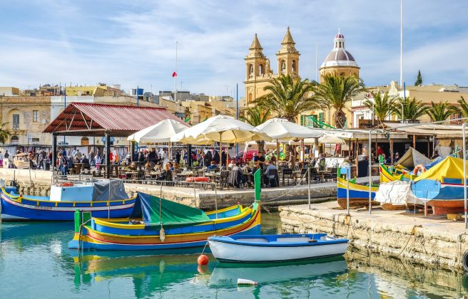 Dramatic Shift in Maltese Regulations of English Language Schools blue and yellow boat on water near brown concrete building during daytime