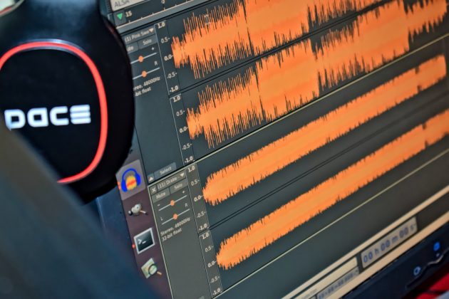 Developing More Accessible Speech Recognition Systems black and red headphones on black computer monitor