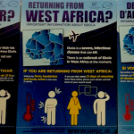 Ebola health protection signs at Dublin Airport in Gaeilge, English, and French.