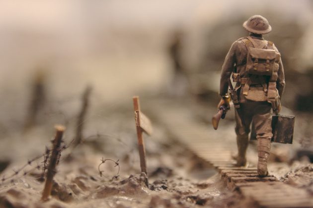 Afghan Interpreters Seek Special Immigrant Visas soldier walking on wooden pathway surrounded with barbwire selective focus photography